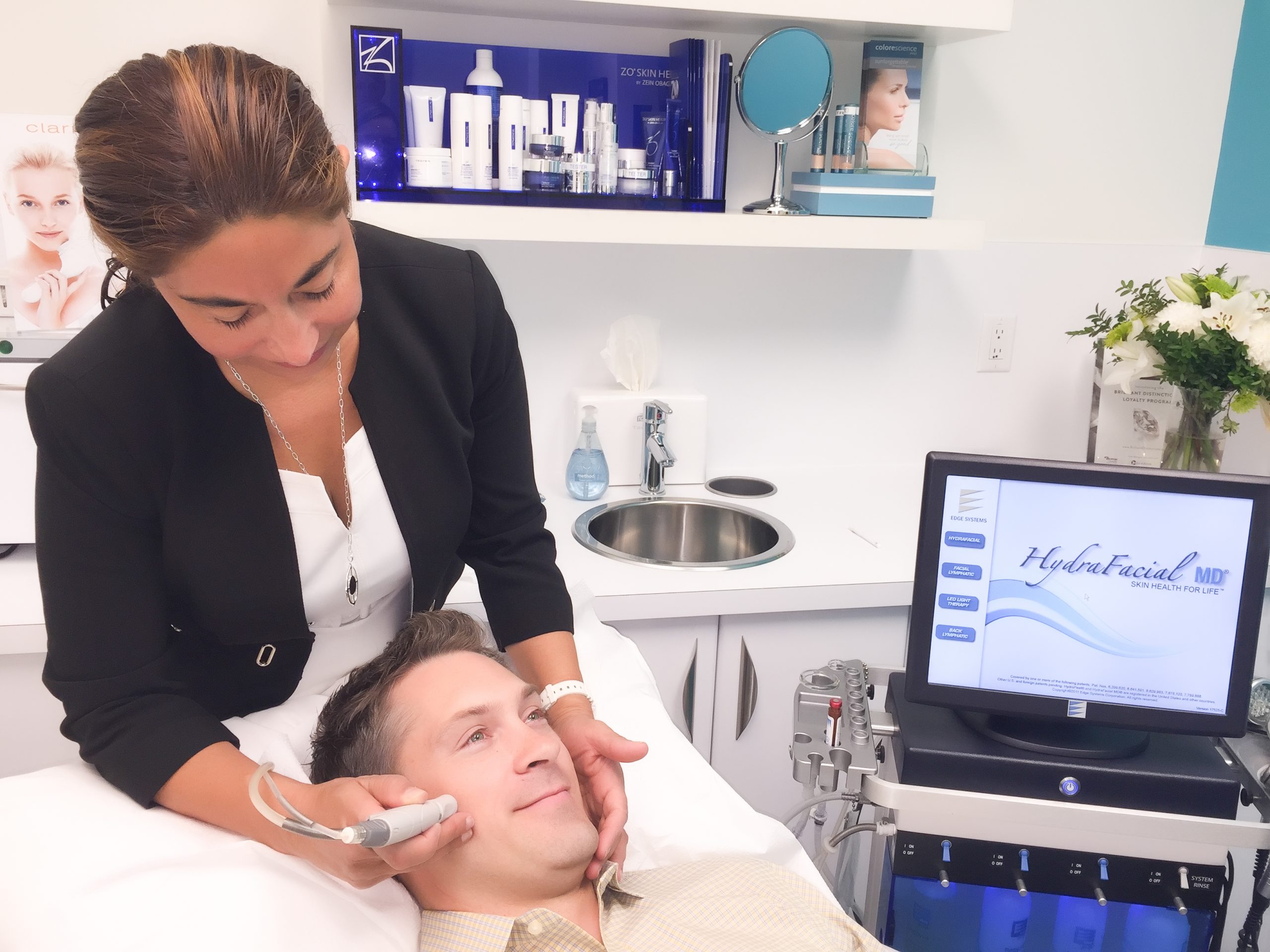 Young male professional receives a HydraFacial at MD Wellness Solutions